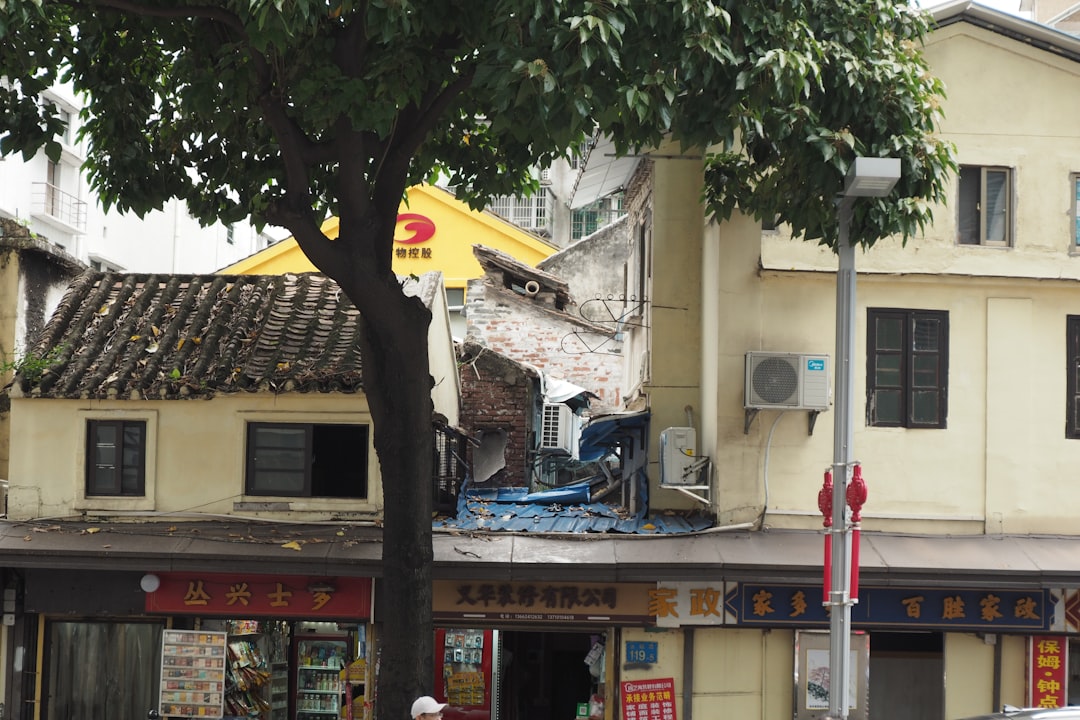 A building that has a tree in front of it