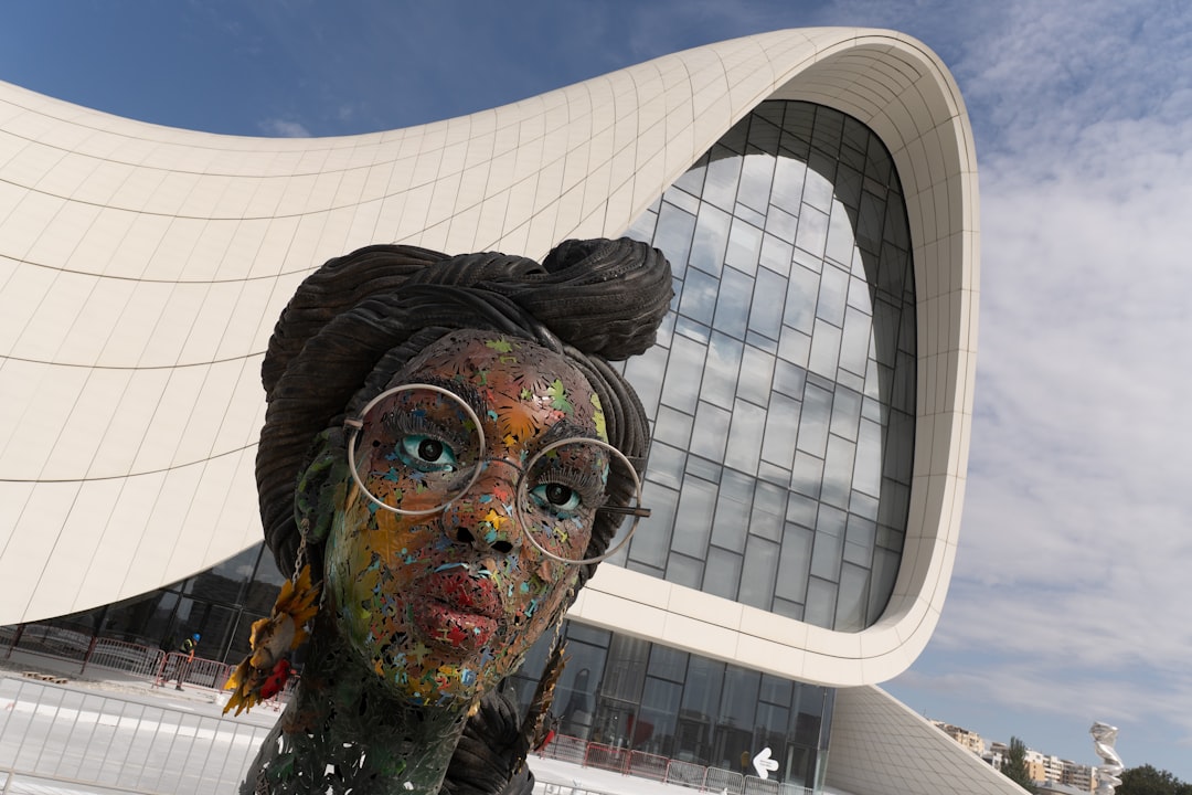 Sculpture with glasses in front of modern building