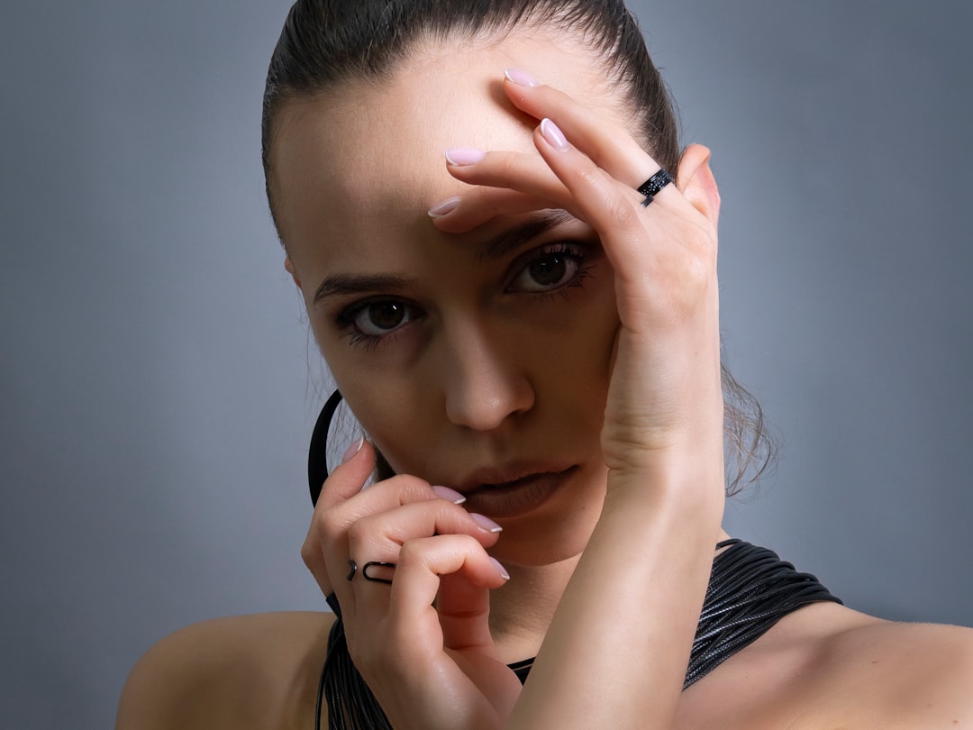 A woman is striking a pose, looking at the camera.