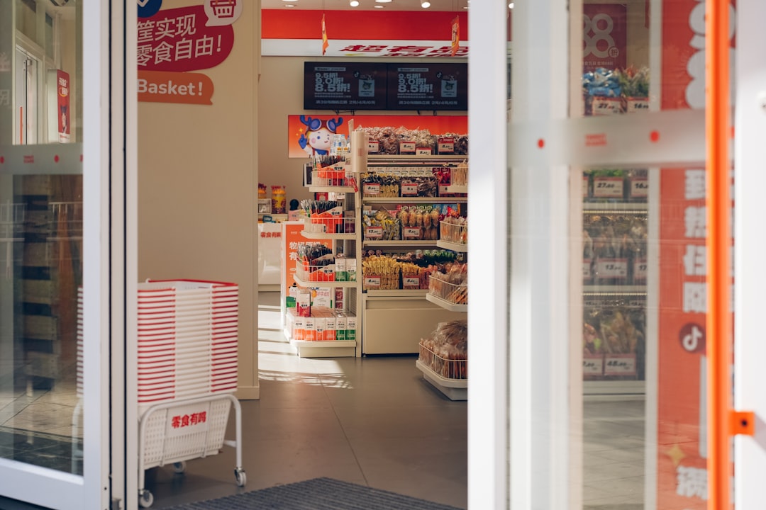 a grocery store with a sign in the window