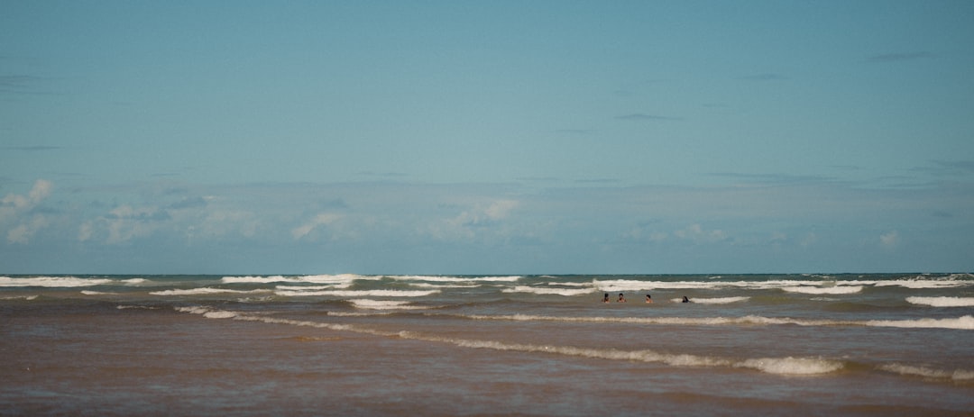 A blurry photo of a beach and ocean